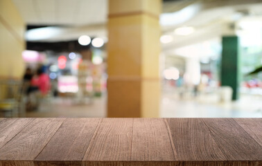 Empty dark wooden table in front of abstract blurred bokeh background of restaurant . can be used for display or montage your products.Mock up for space.