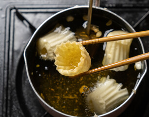 Frying Malaysian Peranakan Chinese thin and crispy pastry tart shell or locally known as Pai Tee. Selective focus.