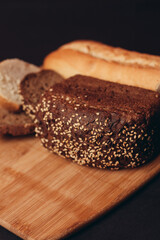 flour products on a wooden board baking loaf of bread