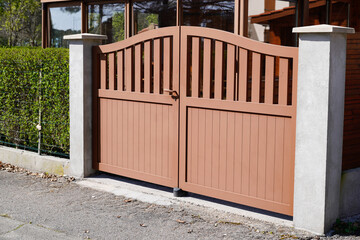 brown portal in metal aluminum of house gate garden access door