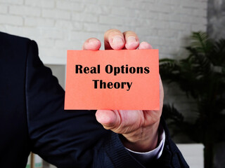  Financial concept about Real Options Theory with inscription on the sheet.