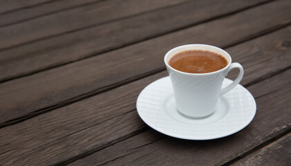 Turkish coffee on wooden table, front view
