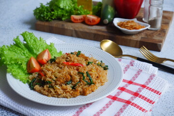 a plate of fried rice served with vegetables 
