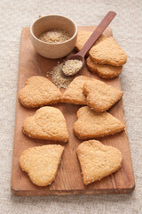 Homemade crispy cookies with sesame seeds in the shape of heart