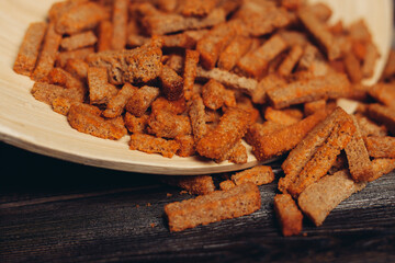 croutons on a plate snacks for beer snack wooden table