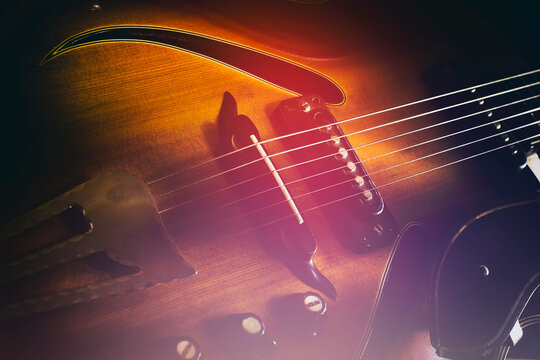 Old jazz electric guitar. Close-up. Background for music festivals, concerts. Musical education. Concert concept.