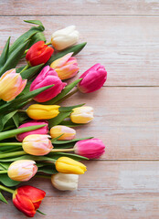 Spring tulips on a wooden background