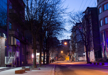 Fototapeta na wymiar deserted street at dawn in spring