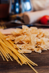 italian pasta cherry tomatoes cooking food kitchen wooden table