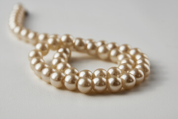 Pearl necklace on white background, close-up