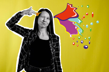 Portrait of a girl who shows a gun gesture to her head with her fingers and the brain explodes with...
