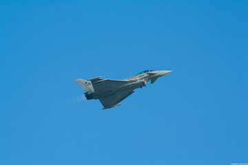 Fototapeta na wymiar Militar jet Eurofighter Typhoon flying at an airshow