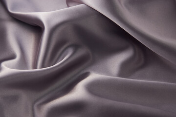 Gray silk fabric background, top view, close-up