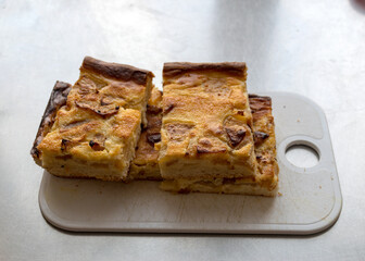 sliced apple pie on a plastic board, school catering concept, lunch for students
