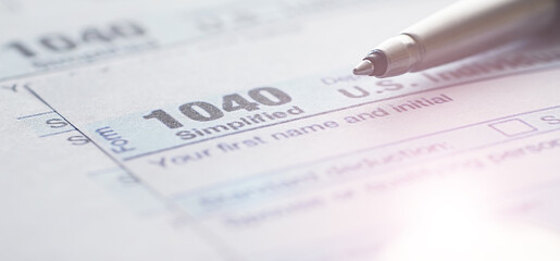 Annual tax reporting. Tax form on the table. Financial statements for signature.
