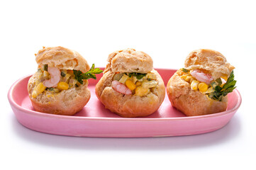Shrimp Salad Profiterole. Profiteroles with a salad with shrimp on the white