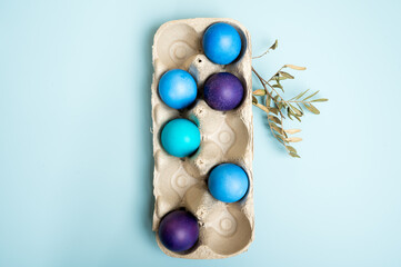 Fototapeta na wymiar Multi-colored Easter eggs in an egg tray