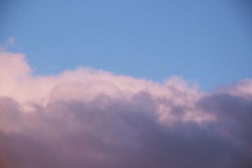 beautiful evening cloudscape with big fluffy cumulus clouds