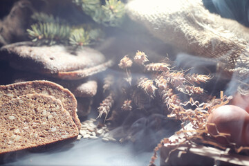 Fresh loaves of bread with wheat and gluten on a black table. Bakery and grocery concept. Fresh,...