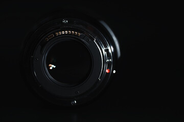 Optics to the camera on the operator’s desk. Flare in the glass of a photo lens. Background with...