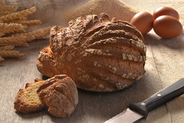 Traditional loaf of integral bread on rural rustic ambient