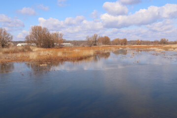 Beautiful view of the wide river and the sky with clouds. Ukraine, Cherkasy