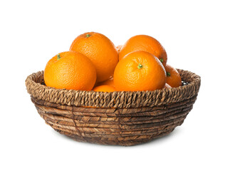 Fresh ripe oranges in wicker bowl isolated on white