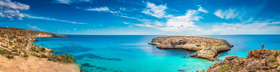 Panoramic view of The Rabbit beach in Lampedusa, Pelagie islands, a wild beach with crystal clear turquoise water - obrazy, fototapety, plakaty