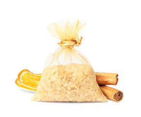 Scented sachet with aroma beads, cinnamon and dried orange slices on white background