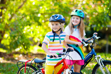 Kids on bike. Children on bicycle. Child biking.