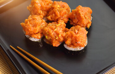 appetizing fish tartare sushi served nicely on a black plate