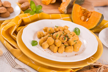 Pumpkin gnocchi with grated amaretti cookies.
