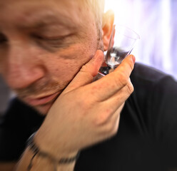 tired and drunk guy addicted to alcohol
