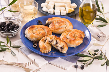 Pastry swirls with cheese and olive filling.
