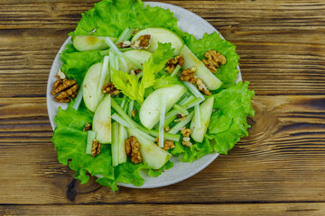 Waldorf salad on a wooden table. Top view