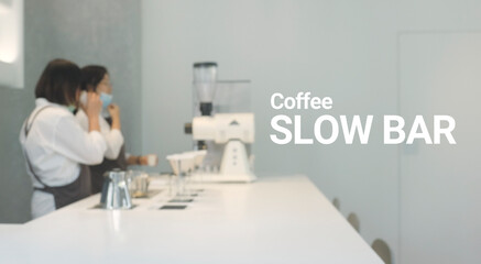 Blur people making of espresso pouring from coffee slow bar.