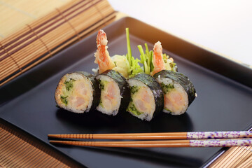 delicious dinner - healthy and tasty sushi with rice appetizingly served