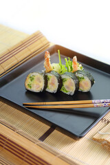 delicious dinner - healthy and tasty sushi with rice appetizingly served