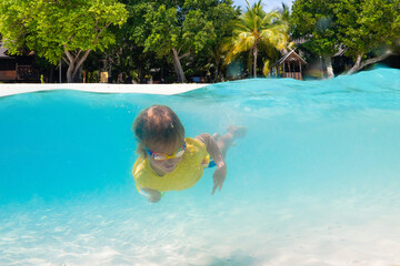 Kids playing on beach. Children play at sea.