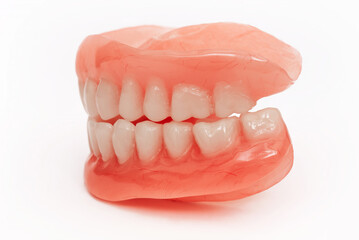 Full removable plastic denture of the jaws. Set of dentures on a white background. Two acrylic...