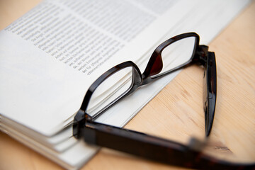 Reading glasses with newspaper
