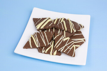 heap of cocoa shortbread diamond cookies with white chocolate