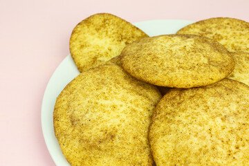 heap of snickerdoodle cookies with sugar and cinnamon