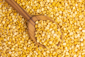 dried chana dal beans with a wooden spoon - 422032435