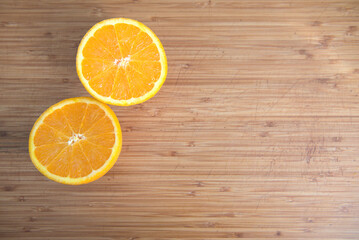 Cut orange on a bamboo board