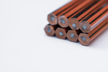 aligned pencil with white background, sign, up and down