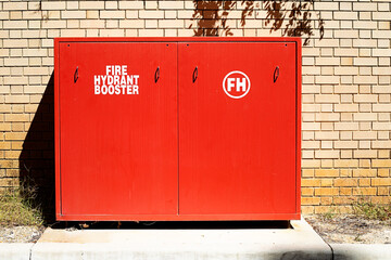 Red fire hydrant booster cabinet
