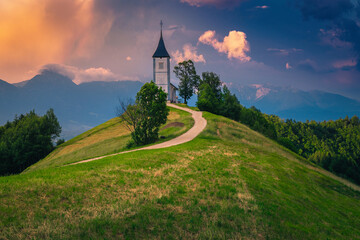 Saint Primoz mountain church at sunset, near Jamnik, Slovenia - obrazy, fototapety, plakaty