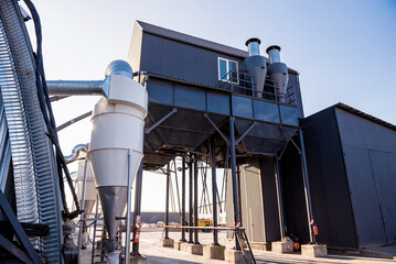 Industrial metallic construction at background with clear sky