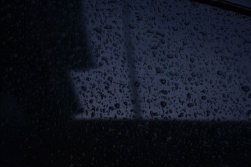texture of raindrops on the windshield of the car